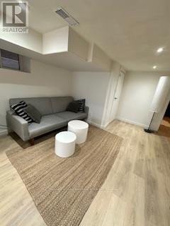 Living room - Lower 115 Northcliffe Boulevard, Toronto, ON M6E3K5 Photo 1